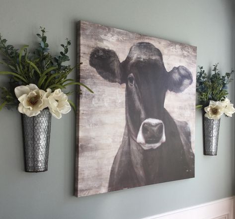 Magnolia eucalyptus galvanized wall planters canvas cow print Cow Wall Art Farmhouse Style, Cow Picture Dining Room, Cow Canvas Decor Living Rooms, Cow Wall Art Living Rooms, Farmhouse Wall Decor Living Room Artwork, Cow Wall Decor Bedroom, Farmhouse Cow Picture Decor, Cow Canvas Decor, Cow Print Bedroom Ideas Rustic