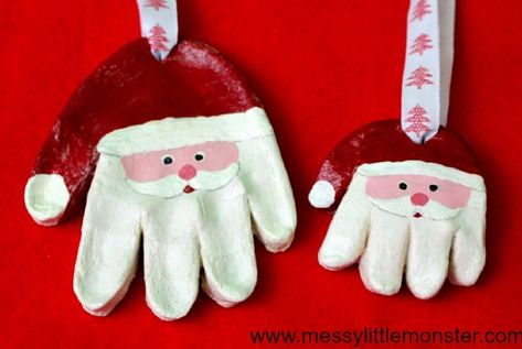 DIY Christmas Ornaments to Make With Toddlers santa hands made from clay and painted as santa faces Diy Christmas Ornaments For Toddlers, Ornament Dough, Santa Handprint Ornament, Santa Handprint, Easy Ornaments, Handprint Ornaments, Easy Holidays Crafts, Inexpensive Christmas Gifts, Dough Ornaments