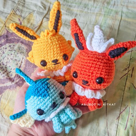 The three OG Eeveelutions (evolutions for Eevee) and my personal favorites: Vaporeon, Jolteon and Flareon! These crochet Pokemon dolls are part of my eeveelution project, and will be selling the patterns on my Ko-Fi, and dolls themselves on Shopee soon! Buy me a coffee? ☕ ko-fi.com/abubotnikitkat Flareon Crochet, Pokemon Dolls, Crochet Pokemon, Pokemon Eeveelutions, Eevee Evolutions, A Coffee, Crochet Amigurumi, Crochet Projects, Pokemon