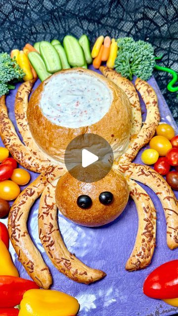 Genevieve LaMonaca on Instagram: "Spider Bread Bowl🕷️Follow @chefgenevieve for 50 Halloween inspired recipes 👻 This spider is too cute to scare anyone, especially when it’s filled with delicious dip!Perfect for a healthy spooky snack or Halloween party treat! 🎃 Who’s brave enough to take the first bite? 🕷️🍞👻?  Ingredients: 15 Rhodes frozen dinner rolls Shredded cheese (I used a 4 blend combo) 2 black olives Spray oil  Homestyle ranch dip  Assorted veggies for dip  Directions: Place 15 frozen dinner rolls over parchment paper. Spray with oil then cover with plastic wrap. Allow to thaw for two hours on the counter.   To make the head: form two rolls into one ball  To make the body: form nine rolls into one large ball  To make the legs: cut remaining four rolls in half creating eight se Spider Bread Bowl Dip, Halloween Bread Ideas, Spider Bread Bowl, Spider Snacks, Halloween Dips, Appetizer Halloween, Spider Bread, Spider Food, Halloween Dip