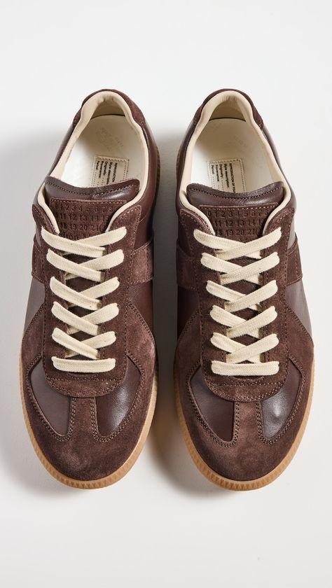 Find MAISON MARGIELA Replica Sneakers on Editorialist. Upper: Calfskin. Suede trim. Cushioned collar and tongue. Removable leather footbed. Lace-up closure. Round toe. Rubber sole. Made in Italy. This item cannot be gift-boxed.