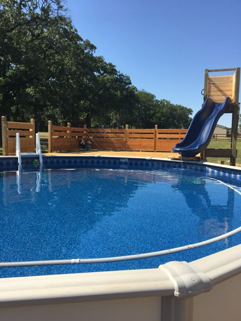 Beachy Pool deck with slide Swimming Pool Slide Ideas, Above Ground Pool Deck Furniture Ideas, Slide Into Above Ground Pool, Slide Into Pool, Above Ground Pool Deck With Pergola, Slide For Pool, Above Ground Pool With Slide, Backyard Ideas With Pool Above Ground, Pool Slides Above Ground