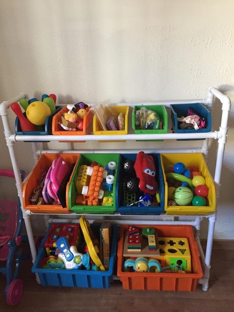 DIY PVC pipe toy organizer with bin boxes Diy Toy Organizer With Bins, Pvc Toy Storage, Toy Organization Diy, Outdoor Toy Storage, Kids Storage Bins, Pvc Storage, Daycare Design, Diy Toy Storage, Diy Storage Bench