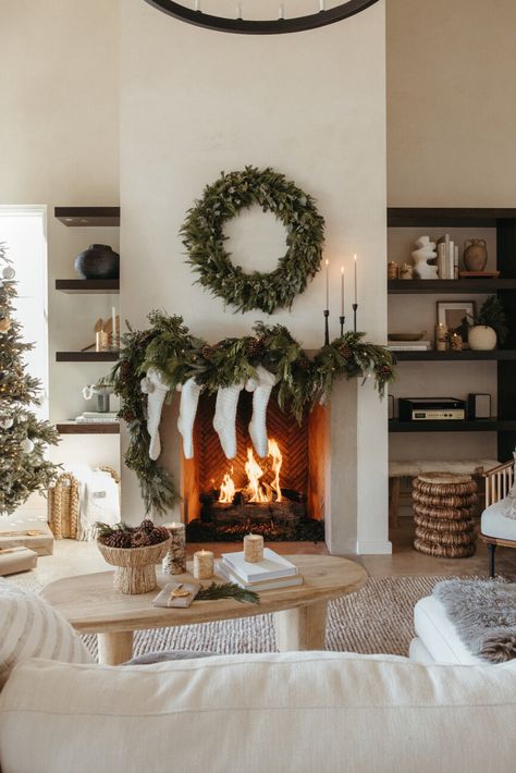 holiday decorated mantel. Holiday Mantel Decorating Ideas, Nancy Meyers Movies, Best Artificial Christmas Trees, Fake Christmas Trees, Pretty Christmas Trees, Front Door Christmas Decorations, White Pillar Candles, Camille Styles, Holiday Mantel