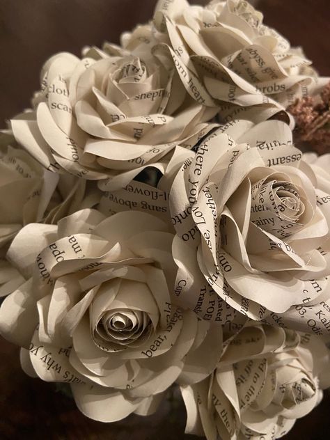 This flower is made from pages of a random book and makes the perfect gift alternative to fresh flowers (no water required). Each rose is made from an up-cycled book. This makes a great 1st Anniversary gift!  If you would like to request a specific book we are happy to custom make it as long as we are able to source the book paper. Please note this may incur an additional charge. Sizes are approximate *  The rose head is approximately is 3 to 4 inches in diameter and the stem is approximately 10 inches long.  Local pick-up is available. Please contact me before purchasing.  ABOUT OUR FLOWERS: I hand-cut each petal from a pattern specifically created for the style of the flower we use in each piece. Each flower will be styled and curled petal by petal to create a beautiful handmade paper ro Anniversary Crafts, Easy Paper Flowers, Upcycle Books, Floral Tape, Flower Ideas, Paper Book, Paper Roses, Origami Paper, Flower Crafts