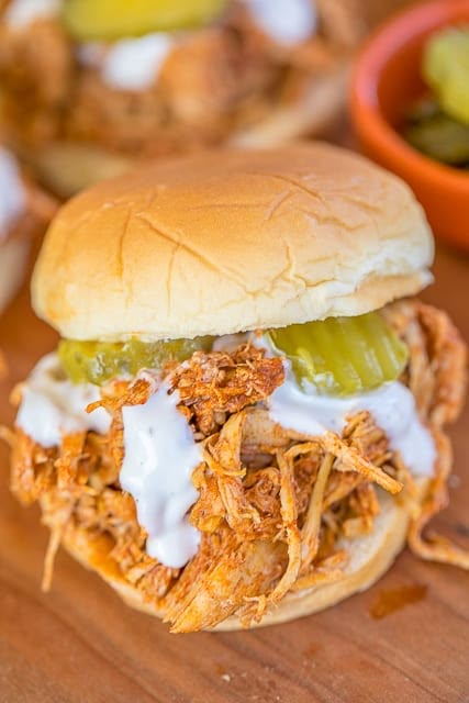 Slow Cooker Nashville Hot Chicken - adapted from the original Hattie B's Hot Chicken recipe in Nashville, TN. SO good!! Chicken, cayenne, brown sugar, garlic powder, paprika, chili powder, butter and chicken broth. Serve the chicken on slider buns with ranch and pickles. SO good! Sweet and spicy in every bite - YUM! #slowcooker #nashvillehotchicken #chickenrecipe #hotchicken Hattie B's Hot Chicken Recipe, Hot Chicken Recipe, Nashville Chicken, Hot Chicken Sandwiches, Chicken Cooker, Crockpot Ideas, Nashville Hot Chicken, Nashville Hot, Slider Buns