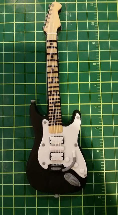 Electric guitar cake topper Electric Guitar Cake Topper, Clay Guitar, Guitar Cake Topper, Electric Guitar Cake, Guitar Cakes, Creepy Halloween Party, Guitar Crafts, Guitar Cake, Miniature Guitars