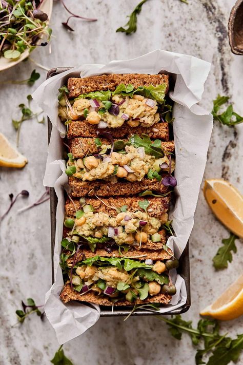 The lightest, freshest, most delicious sandwich perfect for anytime of year is here! My Smashed Chickpea Avocado Salad is perfect on its own, or served on a sandwich, like it is here! My recipe is totally vegan, gluten-free, and packed with plant-based protein. Oh, and did I mention… there’s NO mayo in it? Yup! This recipe is proof that you can get a creamy, chickpea “salad,” sans the mayo! Avocado Salad Sandwich, Kalejunkie Recipes, Chickpea Avocado Salad, Smashed Chickpea, Creamy Chickpea, Chickpea Avocado, Chickpea Sandwich, Salad Spinach, Avocado Sandwich