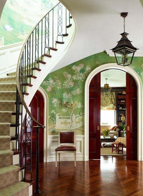 Ashley Whittaker. Architect Tom Felton rebuilt a modifed version of the circular entry hall’s sweeping staircase, a distinctive feature of the circa-1927 J.E.R. Carpenter interior. The Charles Edwards pagoda-shaped lantern plays off the hand-painted Chinoiserie-inspired wallpaper from Gracie Studio. Sconces, Chameleon Antiques. Stair runner, Stark. New York Spaces, May 2013.