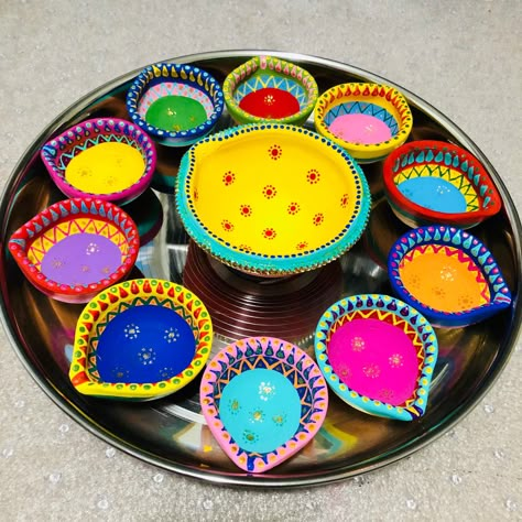 Clay diya, handpainted, celebrating Diwali Diya Coloring Idea, Diwali Panti Decoration Idea, Small Diya Decoration, Diwali Workshop For Kids, Painting On Diya For Diwali, Panti Painting, Simple Diya Paintings For Diwali, Prodip Design, Diya Designs Painting