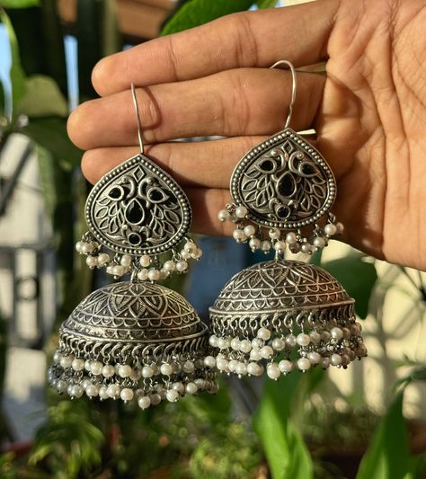 Perfect for any occasion, these stunning earrings are a must-have in your jewelry collection. ✨ 🔗Visit namanarts.in to get yours today! #jhumkas #handcraftedjewelry #jewelrylover #NamanArts #ethnicearrings #FashionJewelry #jewelryaddict #accessorygoals #trendyjewelry #stylestatement #desifashion #TraditionalJewelry #bohochic #statementearrings #indianjewelry #shopnow #earringlove #jewelrysale Jhumkas Aesthetic, Oxidised Rings, Jhumka Collection, Oxidised Jhumka, Capsule Wardrobe Jewelry, Desi Jewellery, Stylish Jewelry Accessories, Oxidised Jewelry, Trendy Silver Jewelry