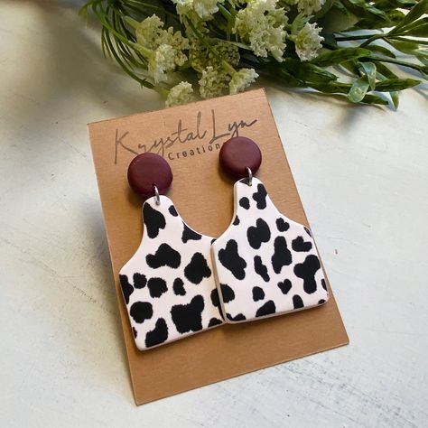 Handmade from polymer clay. They are lightweight and feature stainless steel stud backings Vinyl On Polymer Clay, Western Clay Earrings Ideas, Cow Print Polymer Clay Earrings, Cow Print Clay Earrings, Clay Earrings Western, Polymer Clay Cow Earrings, Western Polymer Clay, Western Clay Earrings, Polymer Clay Keyring