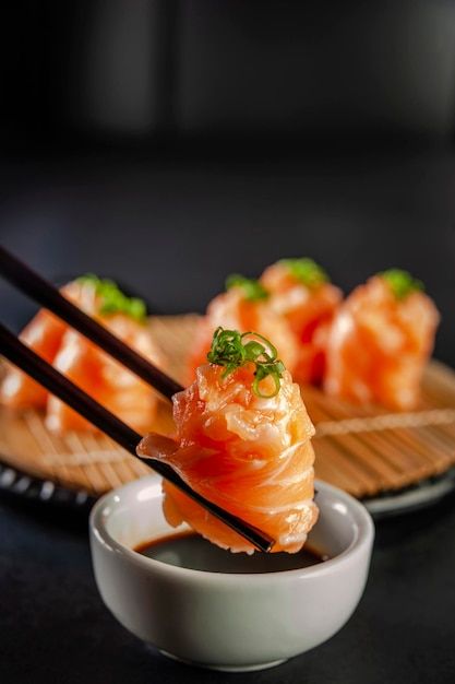 Photo salmon jhow sushi on chopsticks on... | Premium Photo #Freepik #photo #sashimi #salmon-sashimi #sushi-restaurant #sushi Foto Sushi, Japanese Food Photography, Sushi Rice Recipes, Asian Food Photography, Salmon Sushi, Restaurant Photography, Best Sushi, Food Content, Food Drink Photography