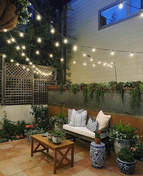 Patio lighting design | house exterior garden lights Patio Overhang Ideas, Festoon Lighting Garden, Diy Backyard Patio, Patio Pavers Design, Small Courtyard Gardens, Courtyard Gardens Design, Outdoor Fairy Lights, Outdoor Lighting Landscape, Backyard Lighting