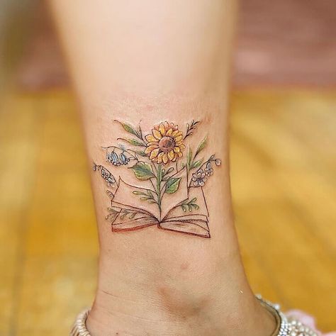 22 Cool Book Tattoo Ideas for Women - Mom's Got the Stuff Whimsical Flower Tattoos For Women, Cool Book Tattoo Ideas, Book Tattoo Wrist, Wrist Book Tattoos, Book Tattoo Ideas For Women, Small Book Tattoo, Open Book Tattoo, Alzheimers Tattoo, Bookworm Tattoo