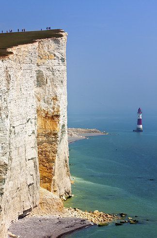 Beachy Head. East Sussex, England. Whoever illustrated the world ran out of ink at Beachy Head. These chalk cliffs are the tallest in all of Britain and attract thousands of clearly not-afraid-of-heights tourists every year.21 Surreal Places In The UK To Add To Your Bucket List Surreal Places, Beachy Head, Visit Uk, Day Trips From London, Visiting England, Beautiful Lighthouse, England And Scotland, Best Beaches, Incredible Places