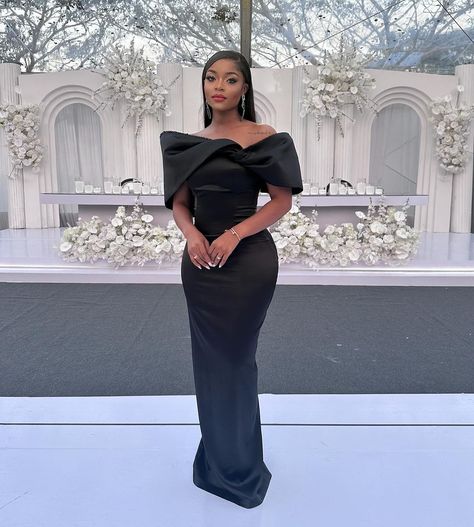 Achieve a Stylish Wedding Guest Status With These 10 Looks Elegant Black Wedding Guest Dress, Evening Wedding Dress Guest, Black Elegant Bridesmaid Dresses, Black Tie Attire Black Women, All Black Formal Wedding Guest Attire, Wedding Guest Dress Ideas Black Women, Formal Wedding Guest Dress Classy, Outfit For Fashion Show Guest, Elegant Wedding Guest Dress Classy