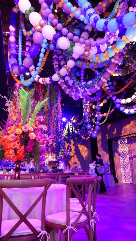 Mardi Gras Bead Installation for Debutant Ball | Badass Balloon Co. | PartySlate Mardi Gras Homecoming, Martygraw Party Ideas, Mardi Gras Masquerade Ball, Martigraw Party Ideas, Mardi Gras Dance Theme, Mardi Gras Balloon Decorations, Rio Prom Theme, Mardi Gras Prom, Mardi Gras Ball