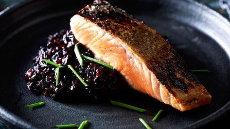 Janet DeNeefe's black rice risotto and salmon (Image: Mark Roper) Salmon Dinner Recipes, Rice Risotto, Moody Food Photography, Dark Food Photography, Black Food, Food Photography Inspiration, Black Rice, Food Photography Styling, Food Presentation