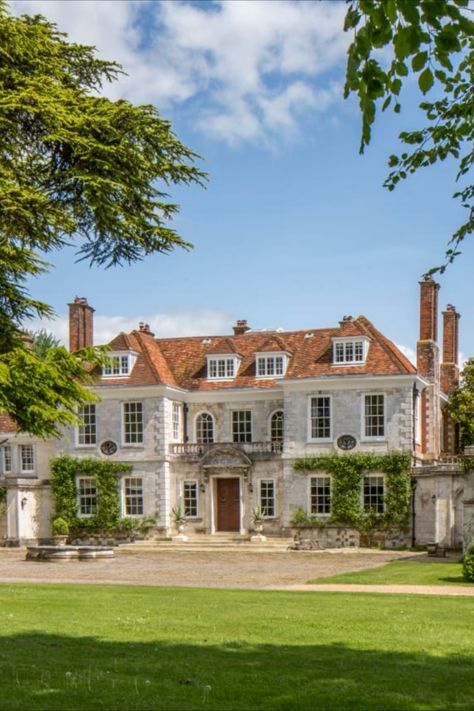 A refined and historic mansion in the pastoral English countryside that is tied to British—and Hollywood—royalty has just hit the market for £13.5 million (US$17.7 million). The more than 300-year-old home is in Hampshire—an area also known as Jane Austen’s County for being the author’s beloved home for much of her life—is known as Shawford Park and the manor is thought to date to 1685. Large British House, British Estates English Manor, British Stately Homes, Old Manor Exterior, Large Manor Exterior, English Countryside Mansion, English Countryside Home Exterior, British Manor Houses, English Manor Exterior