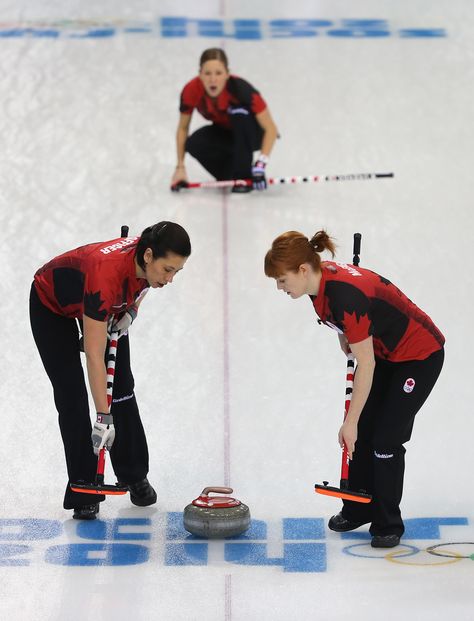 Kaitlyn Lawes of Canada looks on after delivering the stone as Jill Officer and Dawn McEwen of Canada sweep the ice during Curling Women's Round Robin match between Canada and Japan (c) Getty Images Curling Sport Aesthetic, Gertrude Ederle, Ice Curling, Knute Rockne, Curling Stone, Ernie Banks, Simone Biles, Sports Aesthetic, Winter Games