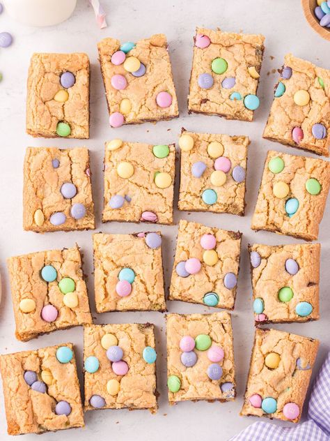 Overhead shot of squares of cookie bars with m&m on top and some around it, a cloth, and a cup of milk. Easter Cookie Bars, Easy Easter Cookies, Swedish Meatballs Easy, Refrigerated Cookie Dough, Chocolate Chip Cookie Mix, Sugar Cookie Mix, Easter Snacks, Easter Cookie, Easter Desserts