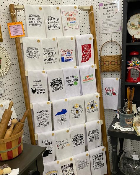 📣 ✨New pricing on my handmade flour sack tea towels means more value for you! I know times are tight right now for everyone including my family. So right now, I am offering handmade flour sack tea towels at a great price of $9.95 each or 2 for $16 in my booth (46, Aisle C) over ar Vendors Village in Clarksville. You’ll also find them for $9.95 in my Etsy shop and at Chosen Goods in Sellersburg (with the exception of my Derby towels). Do you like funny or sweet sayings? I like to hear p... Retail Towel Display Ideas, Craft Show Towel Display, Towel Display Ideas Craft Fairs, Tea Towel Display, Display Towels, Towel Display, Tea Display, Sweet Sayings, Funny Tea Towels