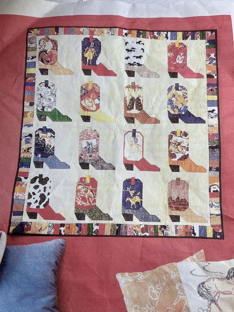 This is a charming quilt kit to make a quilt of pieced cowboy boots designed by Tina Schuman in 2000.  The kit produces a top that measures 37 1/2" x 40 1/2" but you could easily make it larger with your own western stash. The pattern and instructions are included. I purchased this kit at Quilt Festival in Houston in 2000 and have not personally seen it elsewhere. Unused mint condition that has been carefully stored. Boot Quilt Pattern, Cowboy Quilt Patterns, Horse Quilt Patterns, Cowboy Boot Quilt Block, Cowboy Boots Quilt Pattern, Western Patchwork, Cowboy Quilts, Vintage Quilt Patterns, Western Quilts