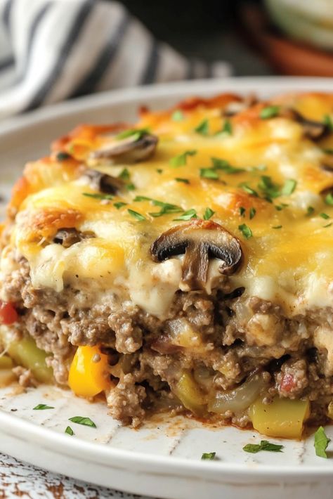 This Philly Cheese Steak Casserole is a wonderfully easy and tasty dinner, brimming with all the beloved flavors of a classic Philly Cheese Steak but transformed into a delightful noodle casserole! Introducing the ultimate Easy Philly Cheesesteak Casserole Recipe! This dish combines seasoned ground beef with peppers, garlic, onions, and mushrooms enveloped in a zesty Cheese Steak Casserole, Philly Cheese Steak Casserole Recipe, Philly Cheesesteak Casserole, Cheesesteak Casserole, Italian Donuts, Steak Casserole, Philly Cheese Steak Casserole, Chocolate Rice Krispie Treats, Au Gratin Potato Recipes