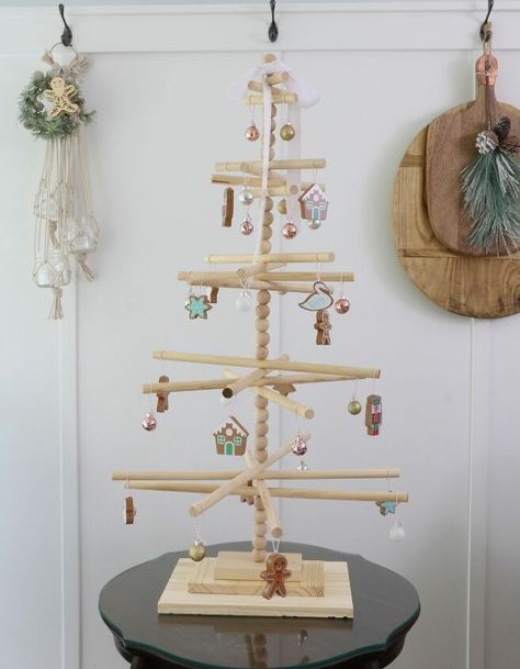 This wooden dowel Christmas tree has that minimalist look I adore with a Scandinavian vibe. It is simple to assemble and will add a fun look to your Christmas decor. Dowel Christmas Tree, Trees Diy, Themed Ornaments, Xmas 2022, Pallet Christmas Tree, Christmas Tree Diy, Pallet Christmas, Minimalist Christmas Tree, Decorating Farmhouse