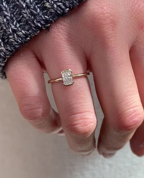 Frank Darling Custom Rings on Instagram: "Small but mighty 💪⁠ ⁠ This 0.5ct budget-friendly stone is looking just as gorgeous in our signature Clutch engagement ring setting.⁠ ⁠ The Ring:⁠ • The Clutch | Radiant⁠ • 0.5ct Radiant Diamond⁠ • H Color, VS1⁠ • 14k Yellow Gold⁠ • 1.7mm band⁠ ⁠ Mark your calendars, darlings! The last day for Thanksgiving proposal orders is November 1st 💍🍁⁠ ⁠ #frankdarlingradiant⁠ ⁠ ••⁠ ⁠ #radiantcut #radiantengagementring #engagementringinspiration #solitairering #solitaireengagementring #radiantcutdiamond #engagementringinspo #showmeyourrings #diamondengagementring #bezelset #halfbezel #bezel⁠ ⁠ 𝐖𝐚𝐧𝐭 𝐭𝐨 𝐠𝐞𝐭 𝐬𝐭𝐚𝐫𝐭𝐞𝐝 𝐝𝐞𝐬𝐢𝐠𝐧𝐢𝐧𝐠 𝐲𝐨𝐮𝐫 𝐝𝐫𝐞𝐚𝐦 𝐫𝐢𝐧𝐠?⁠ 💌 Email us at hello@frankdarling.com⁠ 💍 Take the dream ring quiz, link in our b Small Rectangle Rings Engagement, Small Bezel Engagement Ring, Thanksgiving Proposal, Small Stone Engagement Rings, Frank Darling, Small Engagement Rings, Half Bezel, Radiant Engagement Rings, Engagement Ring Inspiration