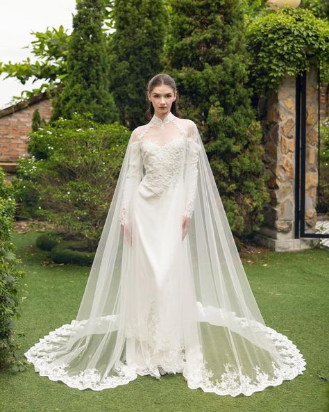 Draped in lace 🤍 Elevate your wedding ensemble with our stunning new bridal cape, designed to add a touch of luxury and elegance to your special day. Whether you're walking down the aisle in a classic wedding dress or a traditional ao dai, this exquisite piece is the perfect accessory to complete your look. Crafted with meticulous attention to detail, our bridal cape offers a blend of timeless sophistication and modern style. The delicate fabric drapes beautifully, providing an ethereal lay... Tulle Cape, Bridal Cape, Dream Dresses, Classic Wedding Dress, Light Ivory, Soft Tulle, Bridal Robes, Draped Fabric, Wedding Veil