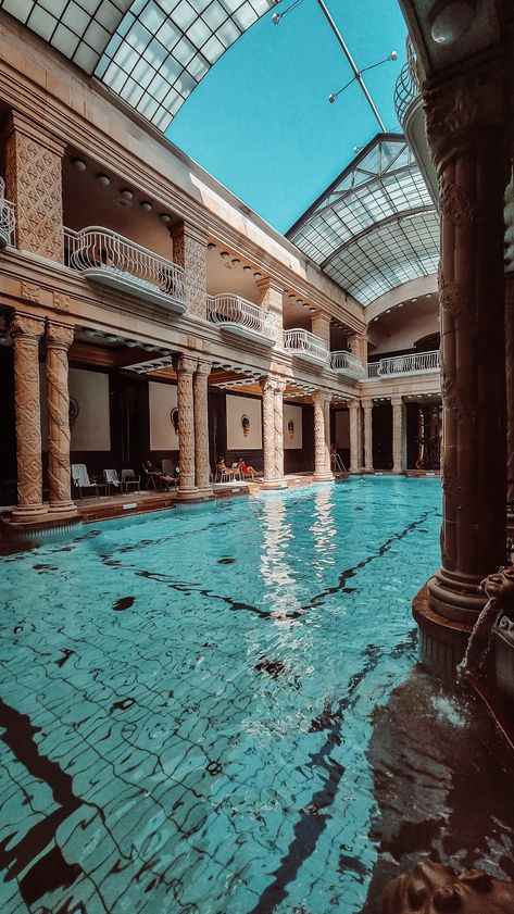 Semi outdoor pool with beautiful clear blue water and antic columns. Gellert Thermal Bath Budapest, Budapest Baths, Budapest Winter, Budapest Vacation, Budapest Thermal Baths, Bath Aesthetic, Visit Budapest, Thermal Baths, Thermal Pool