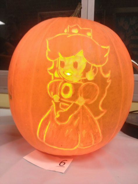 Princess Peach Pumpkin Carving Princess Peach Pumpkin Carving, Princess Peach Pumpkin, Mario Pumpkin Carving, Mario Pumpkin, Princess Pumpkin, Hey Pumpkin, Peach Mario, 90s Fashion Outfits Hip Hop Party, Pumpkin Carving Designs