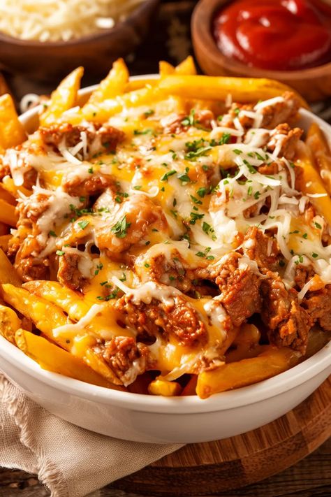 Imagine a plate full of crispy fries, smothered in gooey melted mozzarella and cheddar cheese, and generously topped with seasoned ground beef. Welcome to the world of Cheesy Loaded Fries with Beef and Mozzarella! This dish is a perfect crowd-pleaser, whether you're hosting a game day party, enjoying a cozy movie night, or just craving something decadent. The combination of savory beef, rich... Loaded Fries Recipe Ground Beef, Loaded Fries Ground Beef, Beef Loaded Fries, Queso Fries, Loaded Fries Recipe, Cheesy Food, Cheesy Fries, Cozy Movie Night, Chopped Cheese