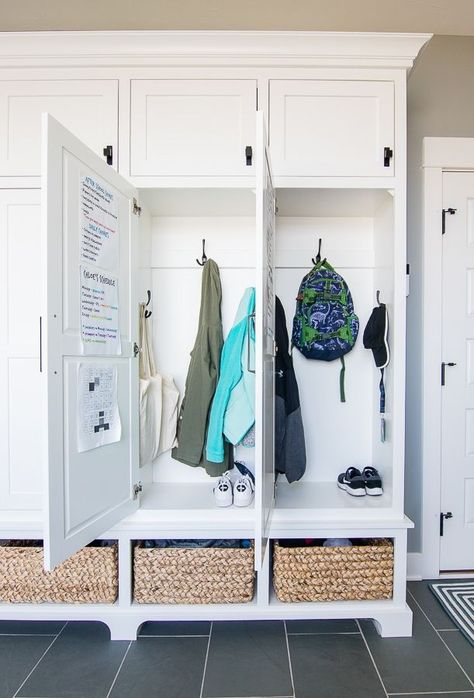 Blue and gray mudroom. Blue slate tile, white lockers and baskets in this lake house mudroom. Lake House Mudroom, White Lockers, Blue Mudroom, House Mudroom, Mudroom Remodel, Armoire Entree, Gray Painted Walls, Mud Room Entry, Mudroom Lockers