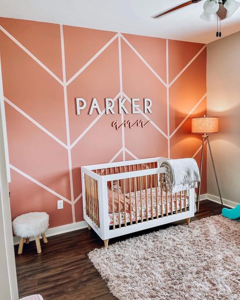 Toddler Girl Accent Wall, Maroon Nursery, Pink Nursery Accent Wall, Nursery Accent Wall Girl, Girl Nursery Wall Color, Light Peach Nursery Walls, Pink Accent Wall Nursery, Peaches And Cream Nursery, Coral Accent Wall Nursery