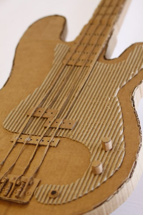 How to Make a Guitar for Your Rockstar More Cardboard Art Projects, Cardboard Guitar, Cardboard Relief, Cardboard Art Sculpture, Collage 3d, Cardboard Model, Handmade Charlotte, Cardboard Sculpture, Sculpture Projects