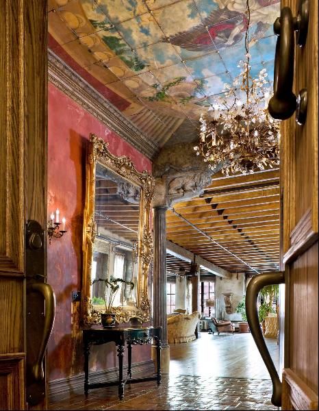 Twelve-foot-tall colossal doors and a large brass knocker make for a grand entrance into Gerard Butler’s two-story loft home. Ny Loft, Art Nouveau Interior, New York Loft, Tuscan Design, Art Nouveau Architecture, Foyer Decorating, World Decor, Gerard Butler, Tuscan Decorating