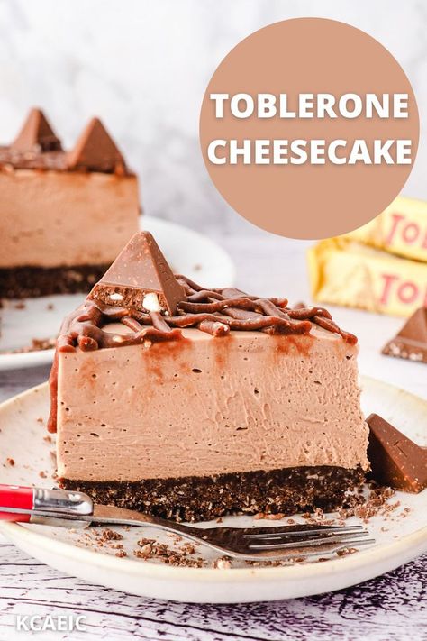 A slice of Toblerone cheesecake on a plate with a cake fork in the foreground and toblerone bars in the background. Toblerone Cheesecake Recipe, Toblerone Cheesecake, Toblerone Chocolate, Chocolate Honey, Uk Recipes, Drip Edge, Almond Meal, Philly Cheese, Buttery Biscuits