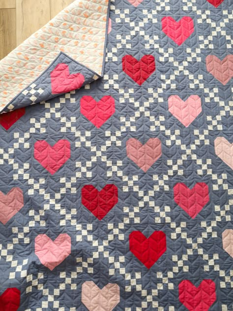 Heirloom Hearts is the perfect, beginner-friendly quilt pattern for Valentine’s Day, an anniversary or any occasion! It is pre-cut friendly, meaning you can use precut 10” squares (layer cake), fat eighths, fat quarters, 1/4 yards and yardage. Use a quick, strip piecing method to create the Irish Chain blocks; and all heart blocks are traditionally pieced. Choose from three sizes: Crib, Throw and Bed. Quilt Heart Pattern, Valentines Quilt Patterns, Valentines Quilts, Quilts With Hearts, Heart Quilt Blocks, Heart Quilt Patterns, Valentines Quilt, Valentines Sewing Projects, Heart Quilt Block