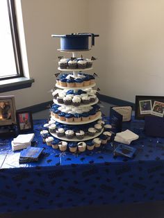 My sons graduation cake/cupcake display 2015 Cake Cupcake Display, High School Graduation Cakes, Graduation Party Pictures, Cake Paris, Graduation Party Desserts, High School Graduation Party Decorations, Backyard Graduation Party, Graduation Party Cake, Senior Graduation Party