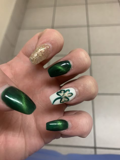 St. Patty’s day nails! Green cats eye, glitter and a clover! Classy St Pattys Nails, St Pat Nails Art Designs, Dark Green St Patricks Day Nails, At Patrick's Day Nails, St Patricks Day Cat Eye Nails, March Acrylic Nails Ideas, Elegant St Patricks Day Nails, At Patrick’s Nails, St Patricks Day Nails Acrylic Coffin