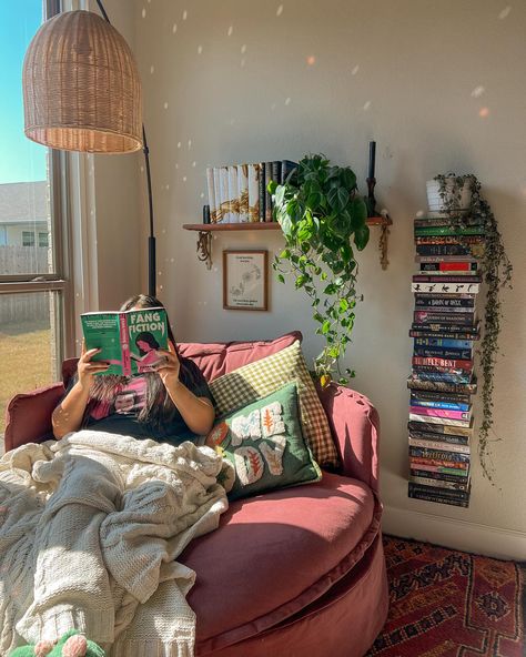 the perfect reading corner doesn’t exi- 🧚🏽‍♀️🍂🎃☕️ guys I love this cozy corner. It’s the perfect size for lounging and reading and naps according to my daughter 😂 I got the @sixpennyhome round daybed in the color summer plum and it’s the perfect pop of color in my room. Thanks to everyone who voted! 🥹 and thank you sixpenny for sending my dream chair over! 💟 update: I am currently in my vampire era and I am enjoying fang fiction! I finished so thirsty & had an amazing time. I have to rea... Cozy Room Winter Aesthetic, Home Reading Area, House Inspo Cozy, Hammock Reading Nook, Dorm Reading Nook, Cozy Daybed Ideas, Cozy Corner Chair Ideas, Day Bed Reading Nook, Hangout Corner In Bedroom