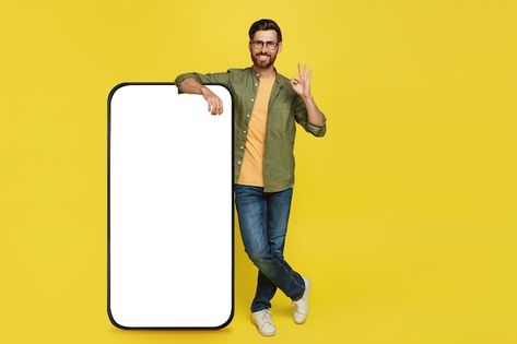 Photo positive stylish man showing okay ... | Premium Photo #Freepik #photo #mobile #mobile-ad #app #phone-app Photo Mobile, Ad App, Blank Screen, Minimalist Phone, Stylish Man, Phone Mockup, Mobile Photos, Man Standing, Branding Materials