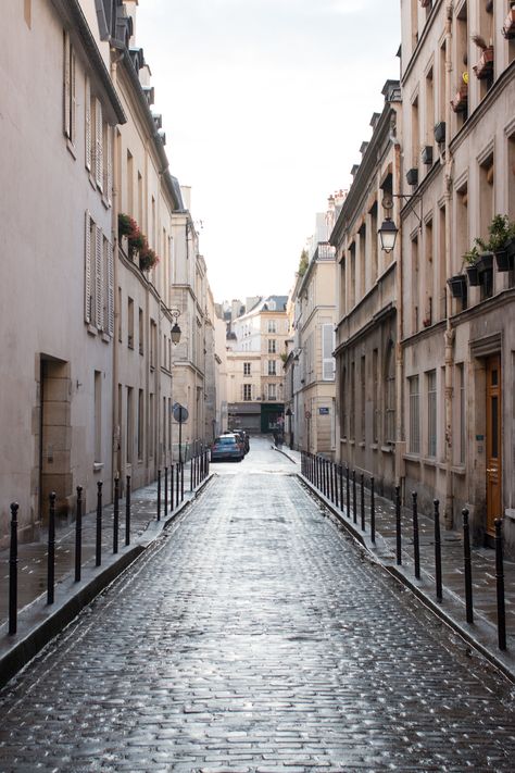 paris in the rain soaked cobblestone streets in the marais Streets In Paris, Paris Door, About Paris, Afternoon Light, Paris Guide, Yellowstone Park, Cobblestone Streets, Paris Summer, City Lifestyle