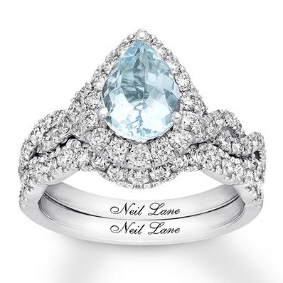 A pear-shaped aquamarine center adds vintage-inspired detail to this glamorous bridal set from Neil Lane Studio. Sparkling round diamonds twist along the band and add brilliance to the center to complete the look. The matching wedding band is lined with more diamonds, bringing the total diamond weight to 1 carat. The bridal set is fashioned in polished 14K white gold. Neil Lane's signature appears inside each band. Diamond Total Carat Weight may range from .95 - 1.11 carats. Neil Lane Bridal Set, Kay Jewelers Bridal Sets, Queens Jewels, Neil Lane, Round Engagement Rings, Aquamarine Engagement Ring, White Gold Wedding Bands, Bridesmaid Accessories, Bridesmaid Jewelry Sets