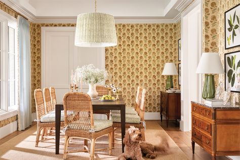 Jasper’s Indian Flower wallpaper forms the dining room backdrop. Louis XVI-style consoles from Jessica Lev Antiques mix with an RH dining table and wicker chairs from Mainly Baskets Home. The pendant drum shade and chair cushion upholstery use the same Carolina Irving Textiles print. Katie Davis Design, Wallpaper Dining Room, White Foyer, Wallpaper Dining, Katie Davis, Farmhouse Style Table, Wicker Dining Chairs, Ranch Style Home, Luxe Interiors