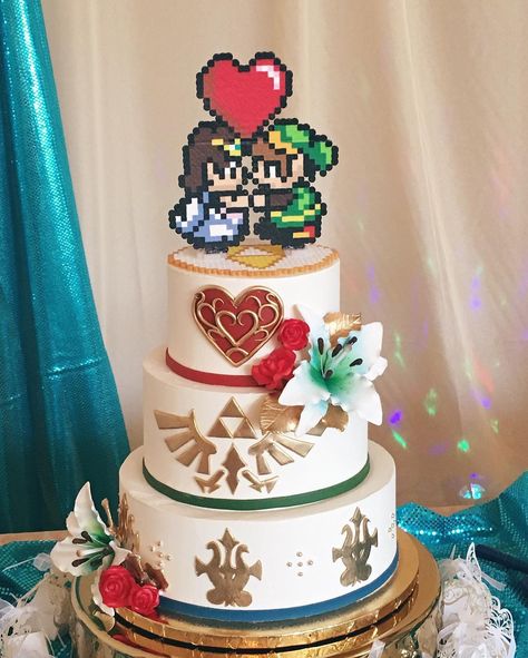 Zelda themed wedding cake? Yep we can do that! #zeldacake #nerdywedding Nerdy Cake Topper, Geeky Wedding Cake, Nerdy Wedding Cake Toppers, One Piece Wedding Cake, Legend Of Zelda Wedding Cake, Video Game Wedding Cake, Wedding Cake Gamer, Kingdom Hearts Wedding Cake, Legend Of Zelda Themed Wedding