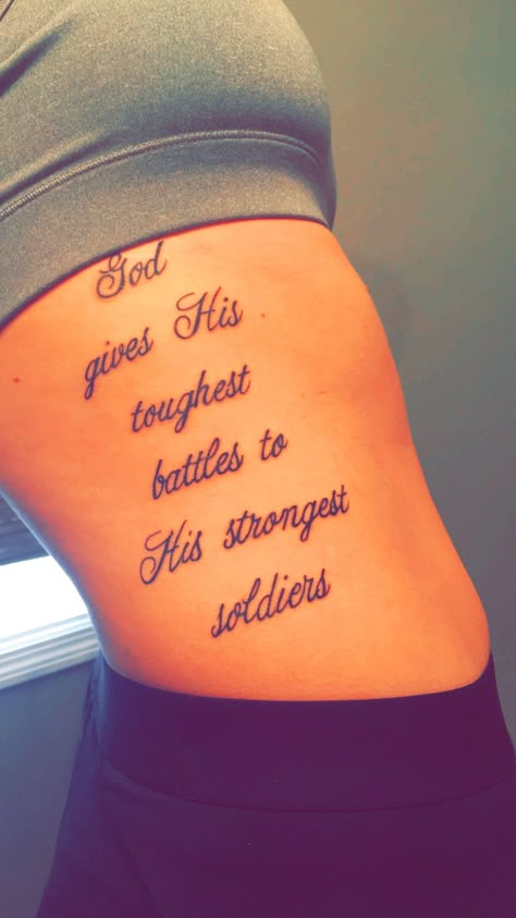 God Gives His Toughest Battles Quotes Tattoo, Neat Tattoos For Women, Thigh Tattoos With Meaning, Back Of Thigh Tattoos Women Writing, Cute Tattoos For Women Ribs, Pretty Rib Tattoos For Women, Female Leg Tattoos Thigh Piece, Inspirational Quote Tattoos, God Gives His Toughest Battles Tattoo